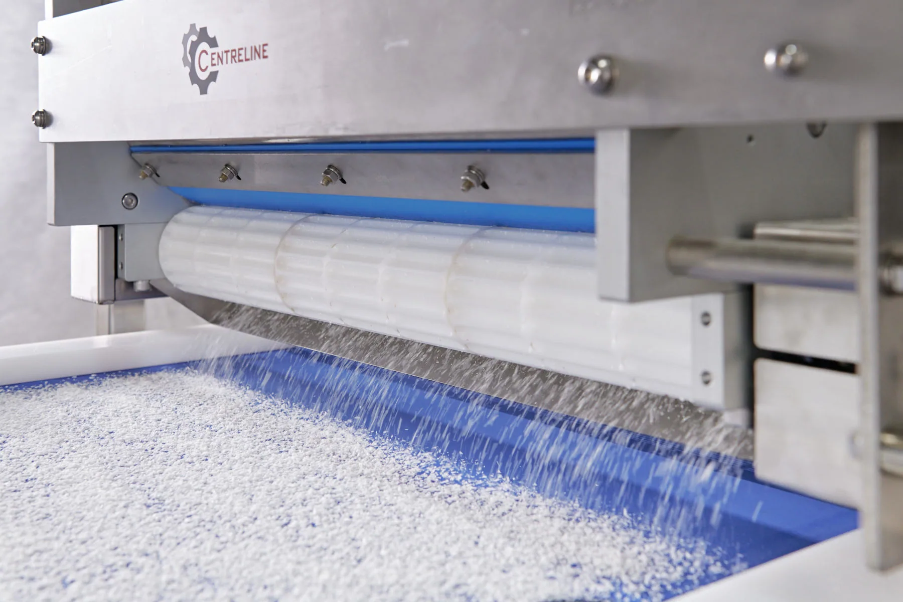 Close view of food processing equipment in operation